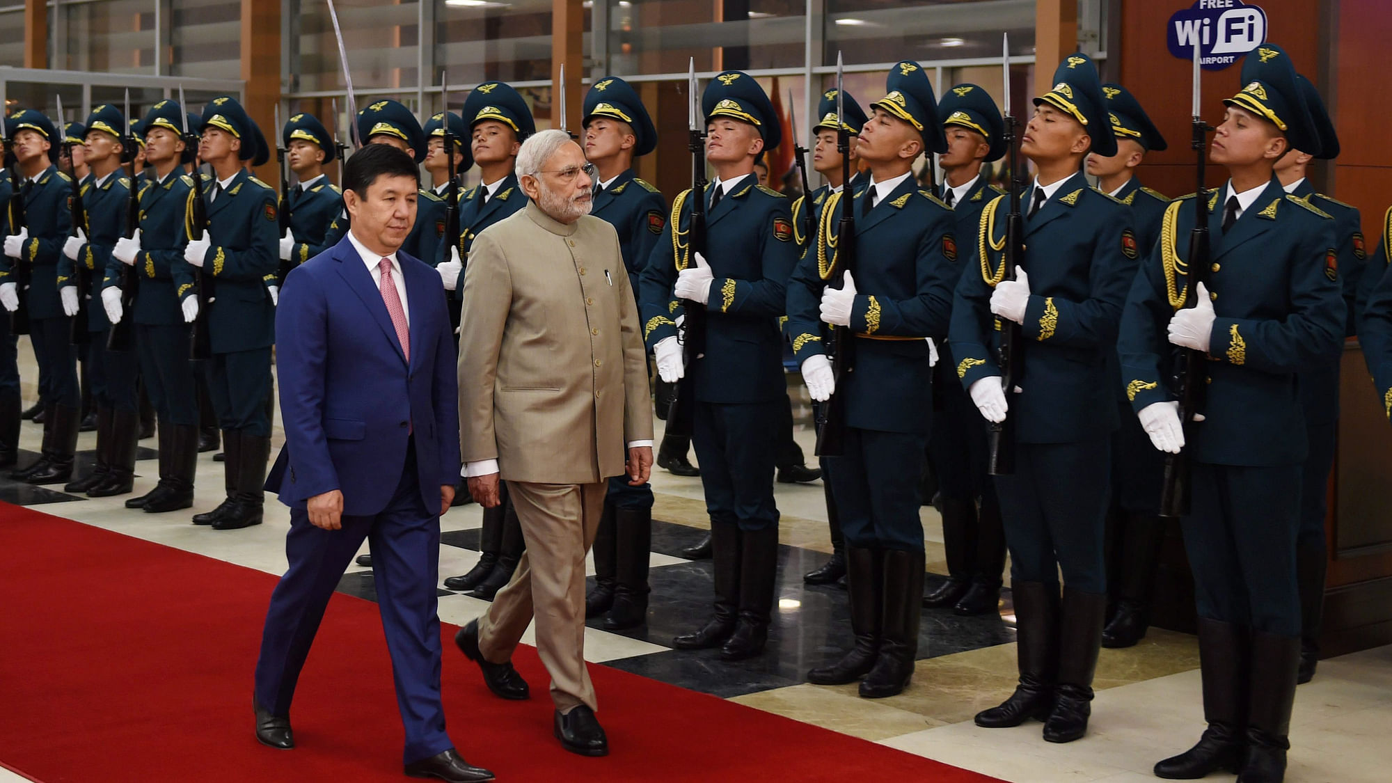 Prime Minister Narendra Modi with his Kyrgyzstan counterpart Temir Sariyev inspect guard of honor during the welcome ceremony at Bishkek, Kyrgyzstan on Sunday. (Photo: PTI)