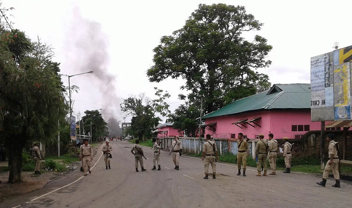 Policemen stand in Greater Imphal after a curfew was imposed in the city. (Photo: Sunzu Bachaspatimayum)