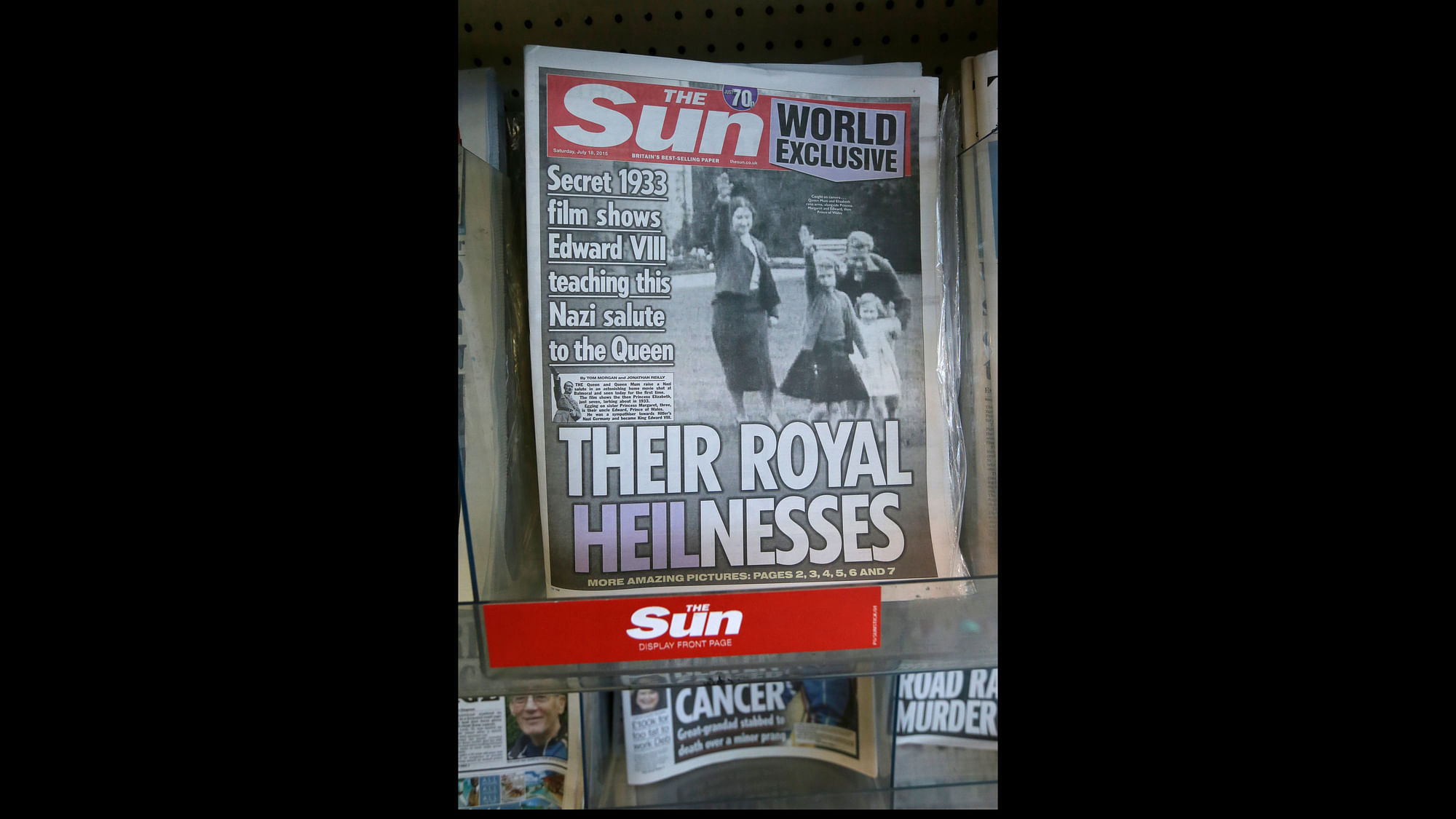 <i>The Sun</i> with a shot from the footage of a young Queen Elizabeth II sporting a Nazi salute on its cover. (Photo: AP) 