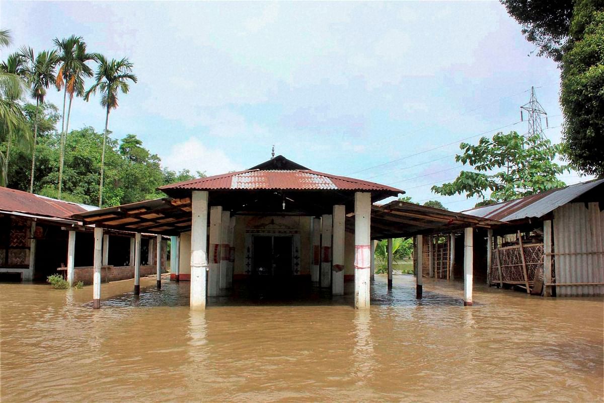 Floods in Assam inundate villages, crops, cuts off roads in Assam districts. 