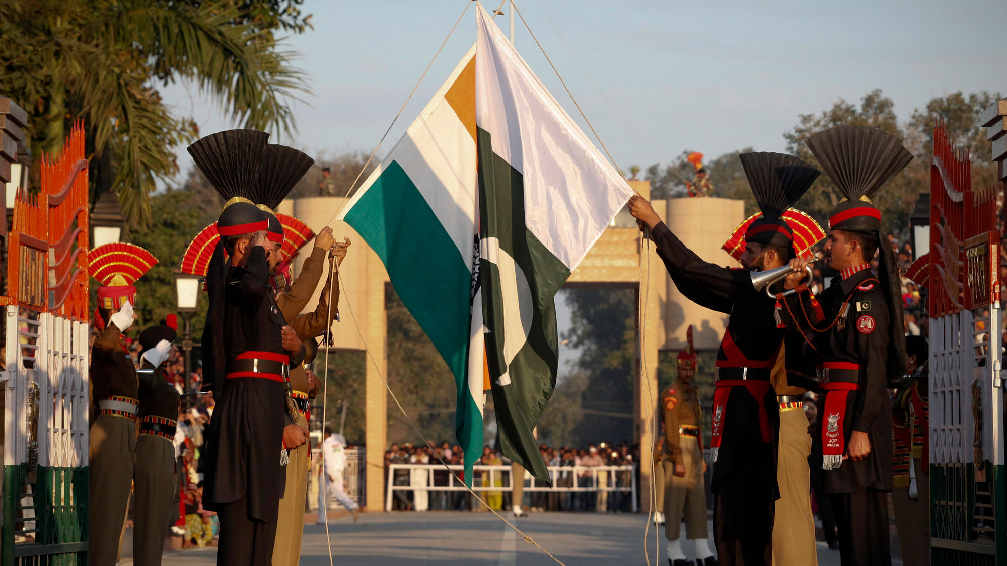 Pakistan Rangers (R) and Indian Border Security Force personnel take part in the daily flag lowering ceremony at their joint border post of Wagah (Photo: Reuters)
