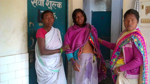 Surajmuni Marandi (centre), 24, an expectant mother at the Godda district hospital in Jharkhand, where she was kept waiting for six hours without medical assistance. The doctor on duty never showed up and the hospital did not provide her food or medicines either. She was forced to pay out of her pocket for her delivery as well as for using the toilet.