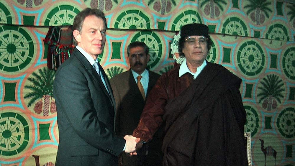 File photo of British Prime Minister Tony Blair shaking hands with Muammar Gaddafi (Photo: Reuters)