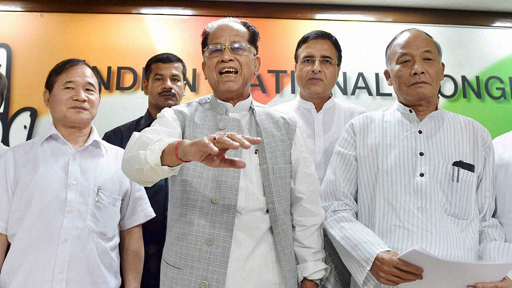 The chief ministers of Arunchal Pradesh, Assam and Manipur (From Left to Right): Nabam Tuki, Tarun Gogoi and Okram Ibobi Singh. Congress leader Randeep Surjewala (between Gogoi and Ibobi Singh) at a press conference at the AICC&nbsp;headquarters in New Delhi, August 7, 2015. (Photo: PTI)