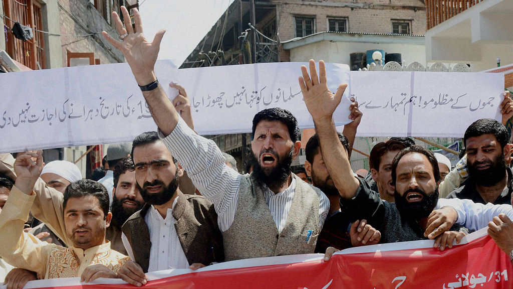 Hurriyat activists shout slogans during a protest in Srinagar.&nbsp;