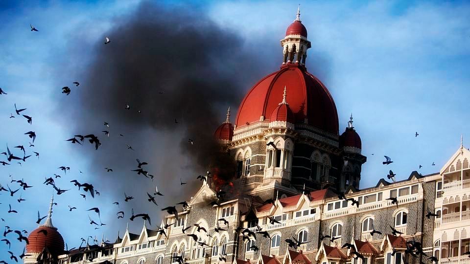A file photo of pigeons flying near the burning Taj Mahal hotel in Mumbai in 2008.(Photo: Reuters) 