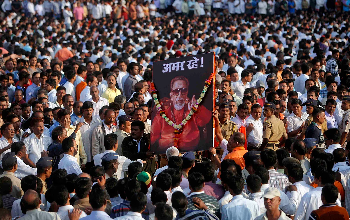 Shiv Sena supporters carry a portrait of Bal Thackeray before his funeral procession in Mumbai in November 2012 (Photo: Reuters)
