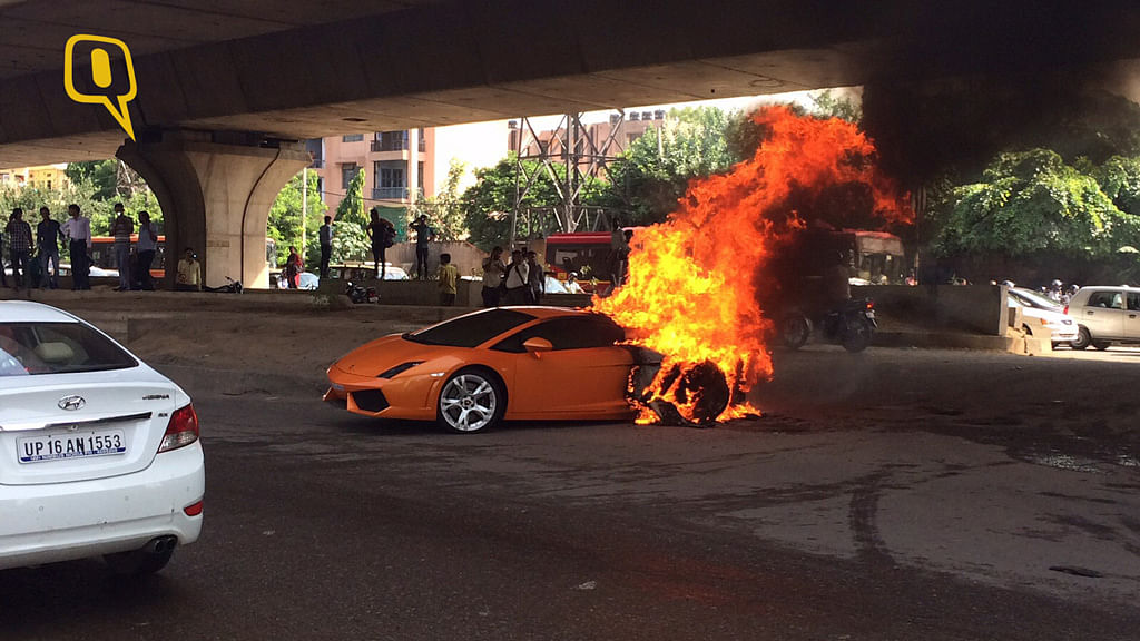 A Lamborghini ablaze in Delhi’s Badarpur area. (Photo: The Quint)