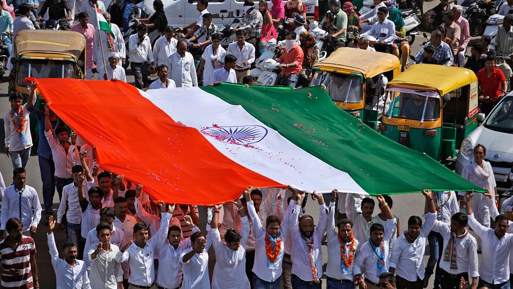 People carry the Indian flag on 15 August 2015. (Photo: AP)
