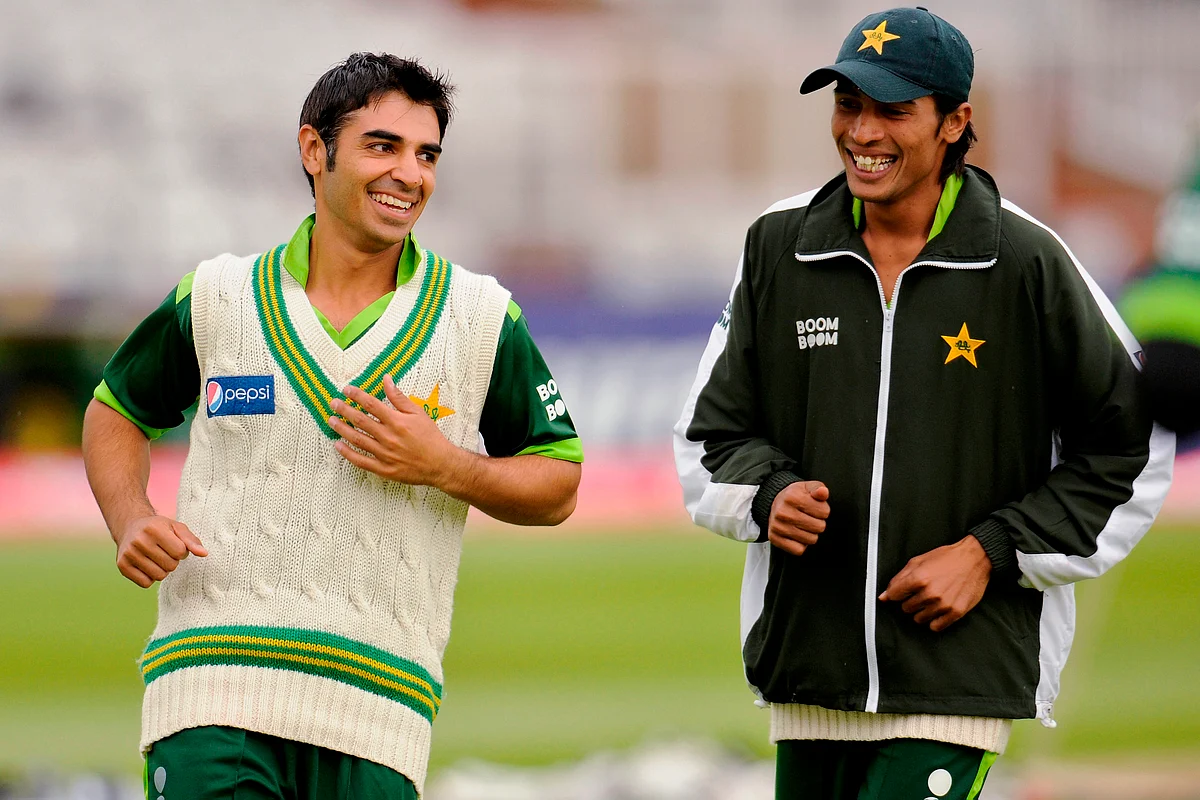 Pakistan’s captain Salman Butt laughs with team-mate Mohammad Aamir (R) during a training session at Trent Bridge, Nottingham. (Photo: Reuters)