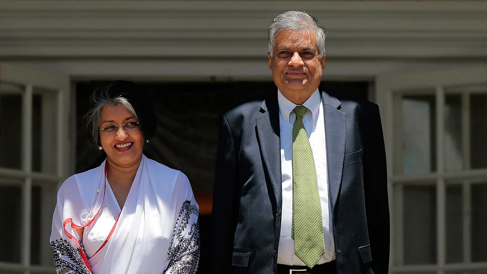 File photo of Ranil Wickremesinghe with his wife Maithree after the swearing-in as Prime Minister of Sri Lanka. (Photo: AP)