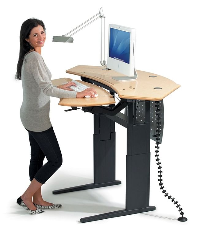 The adjustable standing desk. Stuff that dream workstations are made up of (Photo: iStock)