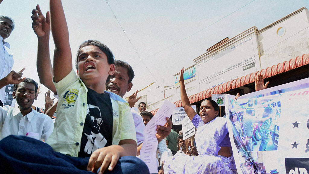 A boy shouts slogans during advocates protest demanding implementation of total prohibition on the liquor shops in Madurai, August 7, 2015. (Photo: PTI)