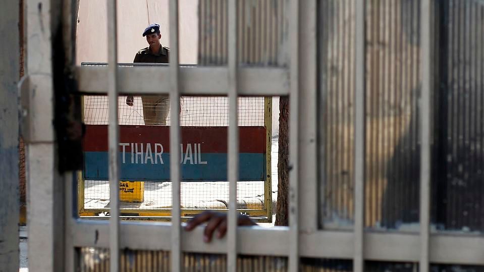 A policeman walks inside  Tihar Jail in New Delhi. (Photo: Reuters)&nbsp;