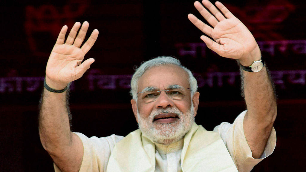 Prime Minister Narendra Modi waves during laying of the foundation stone of four-lane Patna-Buxar road. (Photo: PTI)