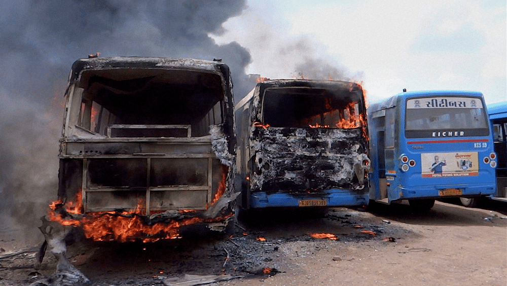The scene after&nbsp;Patel community supporters set ablaze buses in Surat, August 26, 2015. (Photo: PTI)