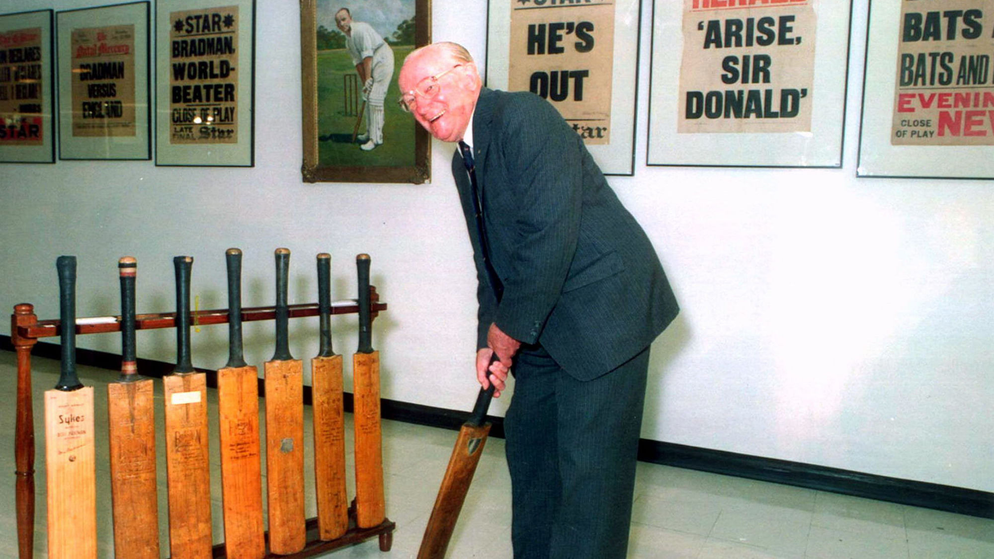 Sir Donald Bradman holds one of his old cricket bats at the opening of the Bradman Collection in Adelaide’s State Library in August, 1998.