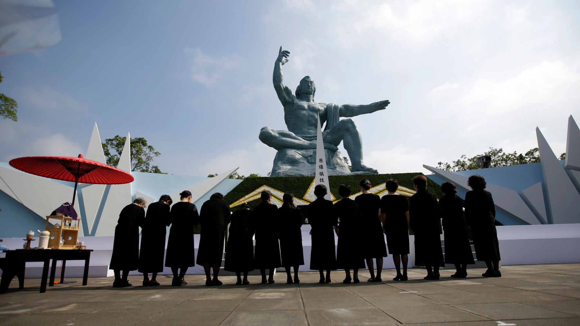 Visitor offer prayers in front of the Peace Statue at the 70th anniversary of the atomic bombing in Nagasaki on August 9 2015. (Photo: AP)<a></a>