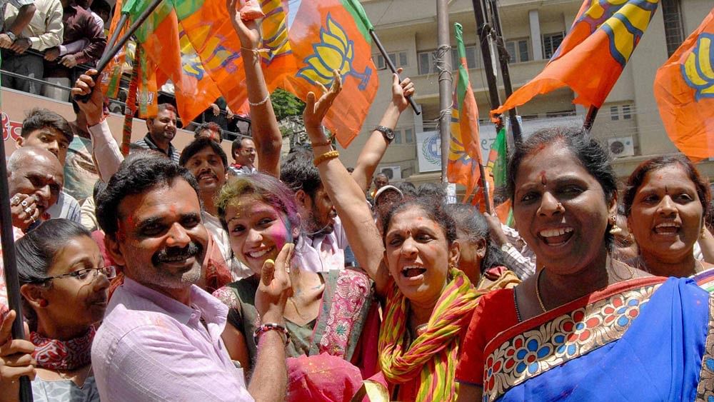 BJP cadres celebrate the victory in BBMP polls. (Photo: PTI)