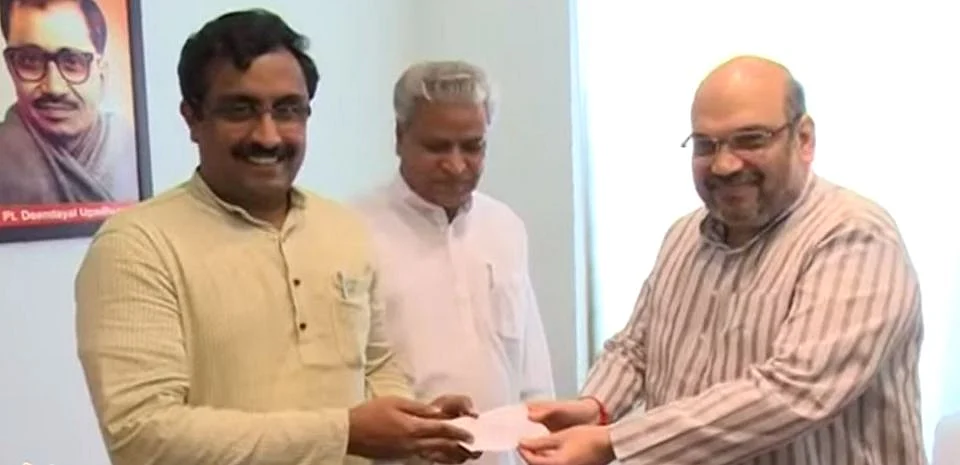 BJP General Secretary Ram Madhav (L), who was the key negotiator in forming the BJP-PDP alliance in Jammu and Kashmir with BJP President Amit Shah (R). (Photo Courtesy: BJP/YouTube)