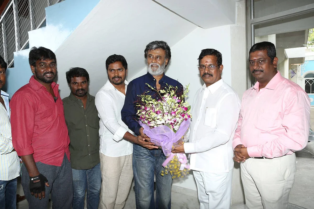 Rajinikanth poses with a bouquet at the <i>mahurat.</i>