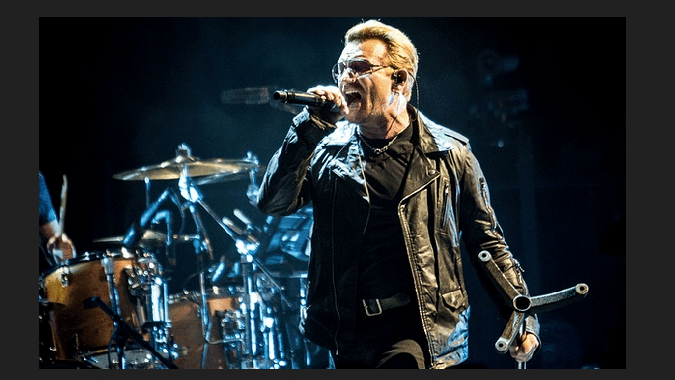 <i>U2</i> frontman and activist Bono offered support to refugees fleeing their homes by changing the chorus of a <i>U2</i> song mid-concert (Photo: Twitter/<a href="https://twitter.com/PA">@PA</a>)