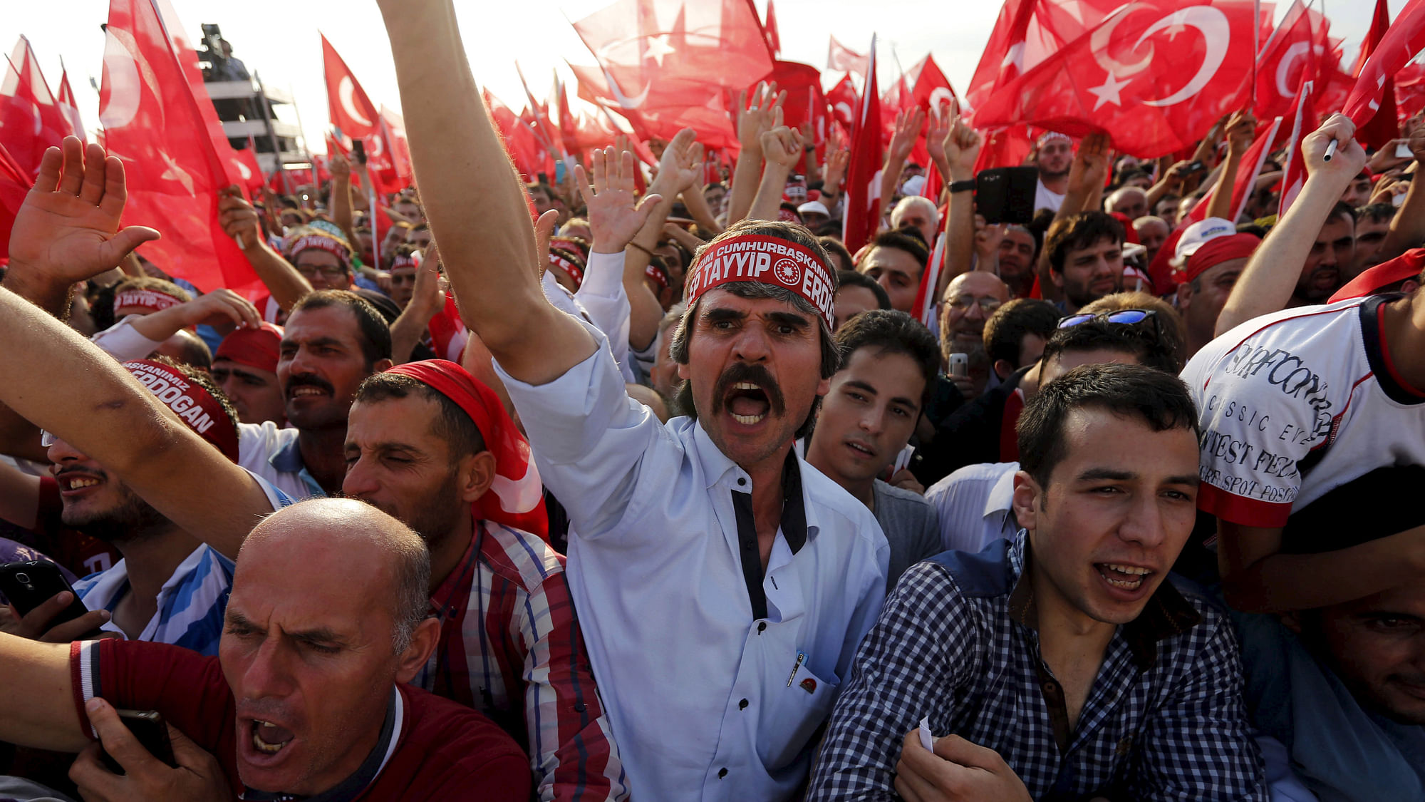 Men wave Turkey’s national flags during a rally against recent Kurdish militant attacks on Turkish security forces in Istanbul, Turkey. (Photo: Reuters)