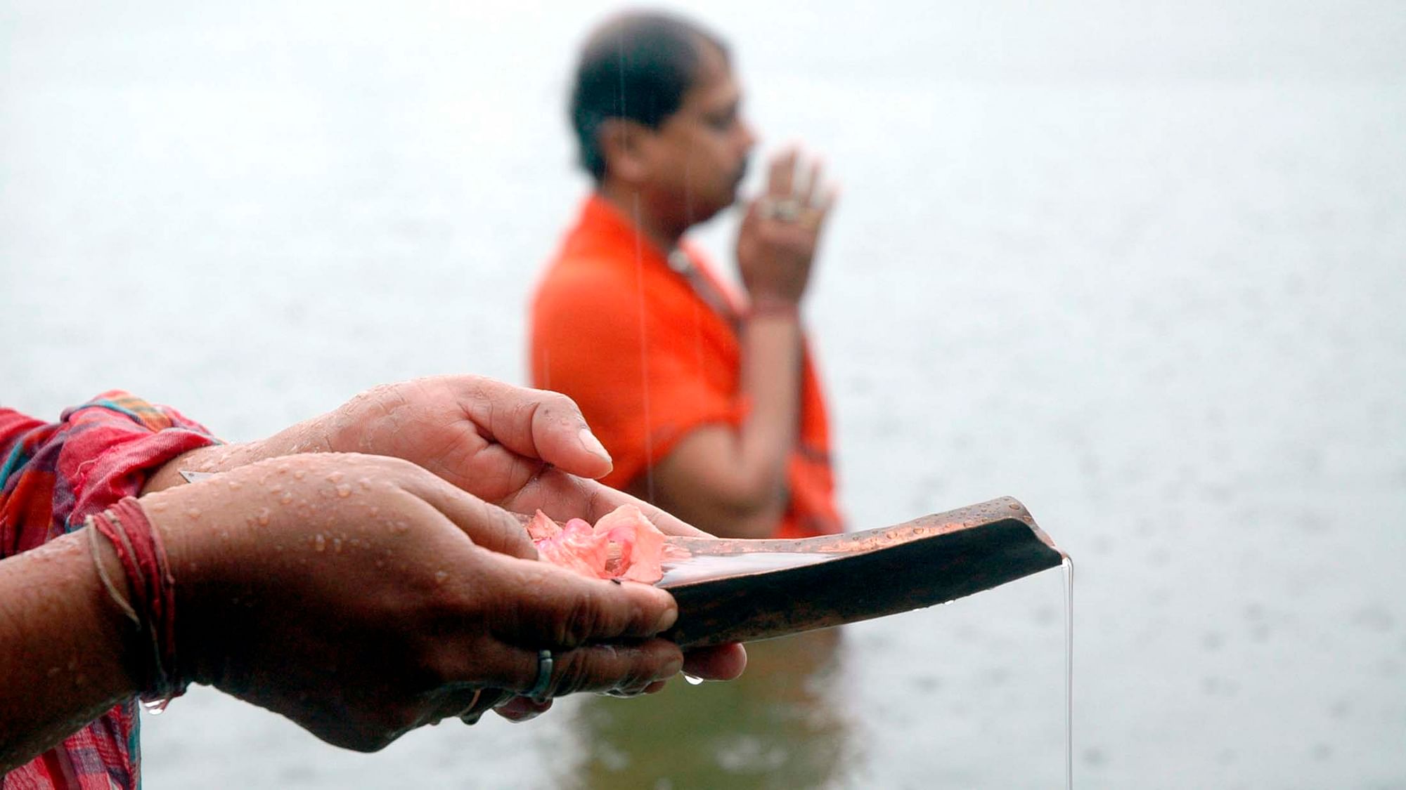 Hindus pray in a pond during the holy day of Mahalaya, the beginning of Pitr-paksh in Agartala. Hindus pray for the souls of their departed ancestors on this day. (Photo: Reuters)