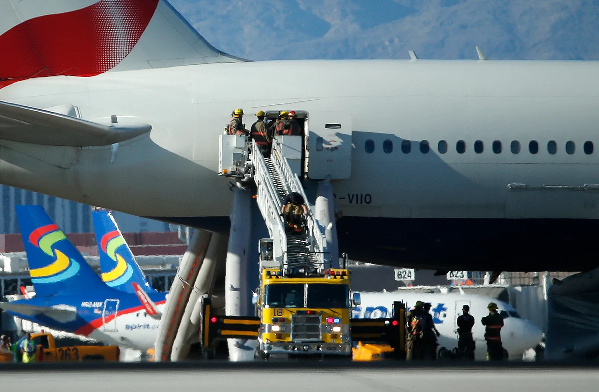 Firefighters enter the plane that caught fire at McCarren International Airport Tuesday, Sept. 8, 2015, in Las Vegas. (Photo: AP)