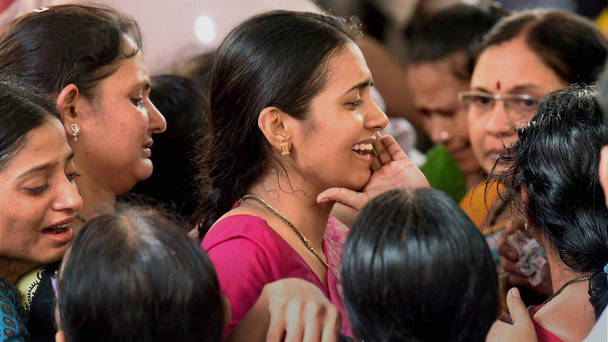 Wife Preeti and other family members wail during the funeral of Parag Sawant.