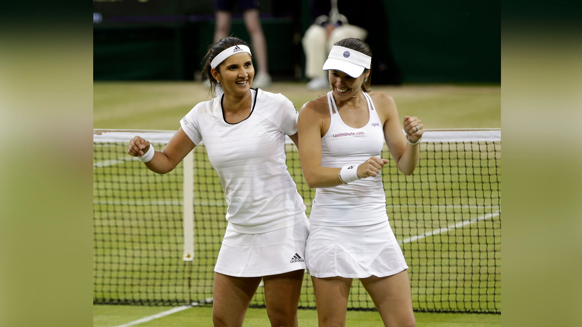 Martina Hingis and Sania Mirza celebrate winning the 2015 Wimbledon women’s doubles final on July 11, 2015. (Photo: AP)