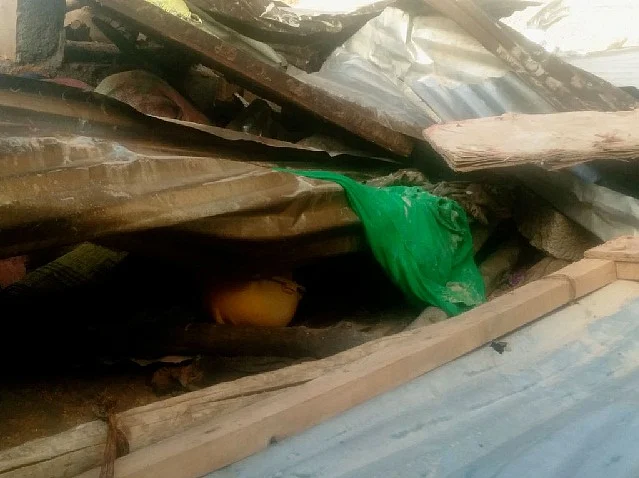 The debris of the compound wall that fell on the sheds. (Photo courtesy: <i>The News Minute</i>)