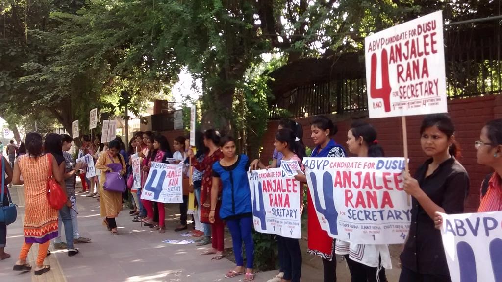 ABVP volunteers campaign near Delhi University’s metro station. (Photo: Neha Yadav/The Quint) 
