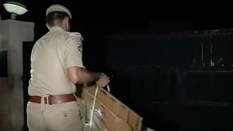 ACB personnel carrying boxes in Singhvi’s house. (Photo: ANI)