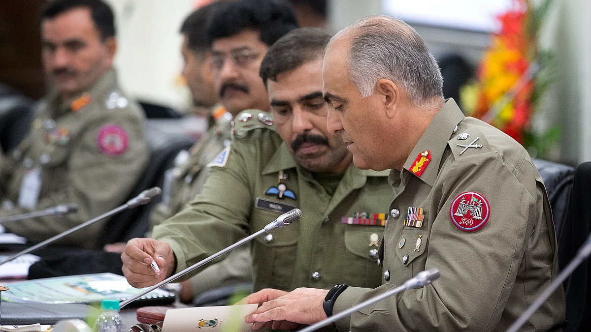 BSF Director General DK Pathak (centre), and Pakistani Rangers Director General (Punjab) Maj Gen Umar Farooq Burki attend a delegation level meeting in New Delhi on Thursday. (Photo: AP)