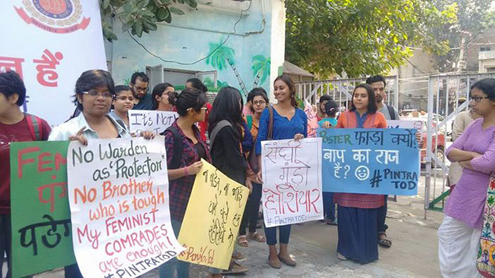 Students from universities  in Delhi have taken to the streets to protest restrictive hostel rules for women. 