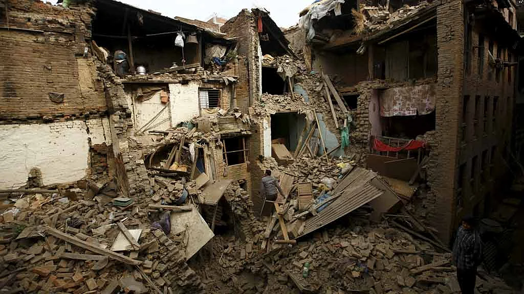 April 26, 2015: People search for family members trapped inside collapsed houses a day after the earthquake in Bhaktapur, Nepal (Photo: Reuters)