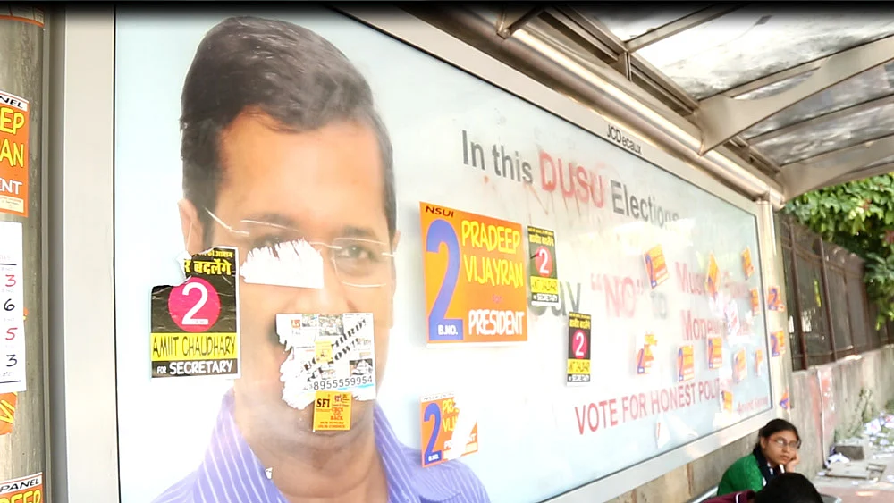 CYSS poster at a bus stop outside Kirori Mal College (KMC). (Screenshot: The Quint)
