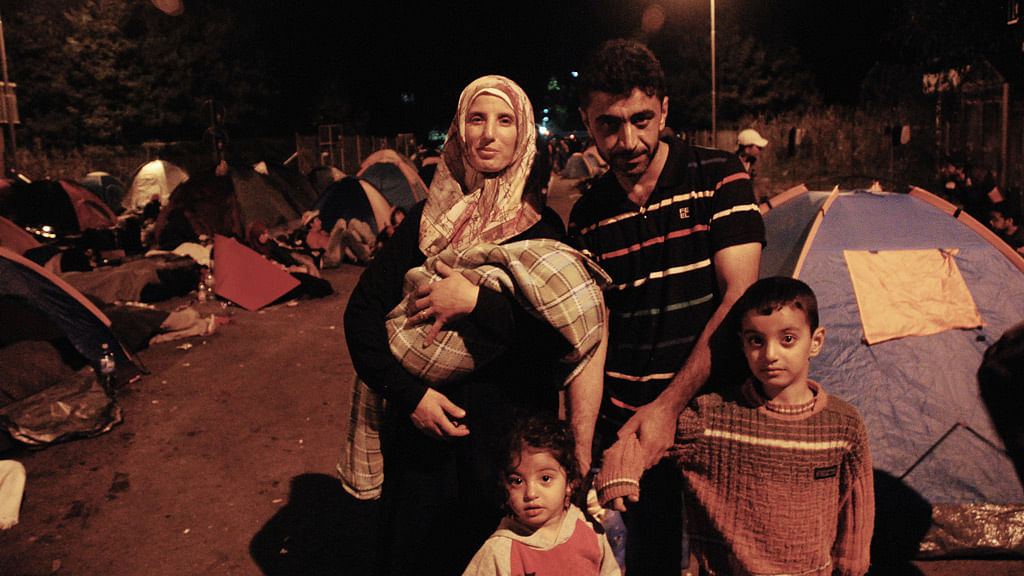 This Syrian family was among the thousands of other migrants who were left stranded on the Serbian side of the border with Hungary after a new law banned their entry. (Photo: Priyali Sur/The Quint)