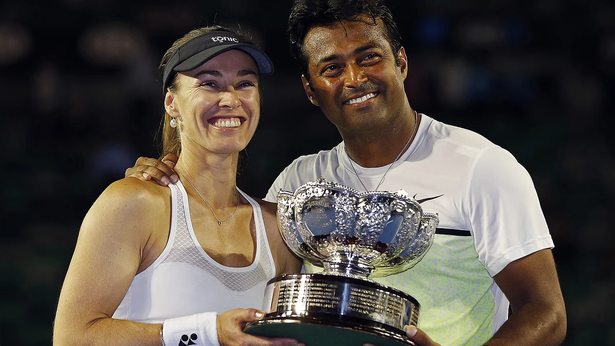 Martina Hingis and Leander Paes pose with the Mixed Doubles Australian Open trophy earlier this year. (Photo: Reuters)