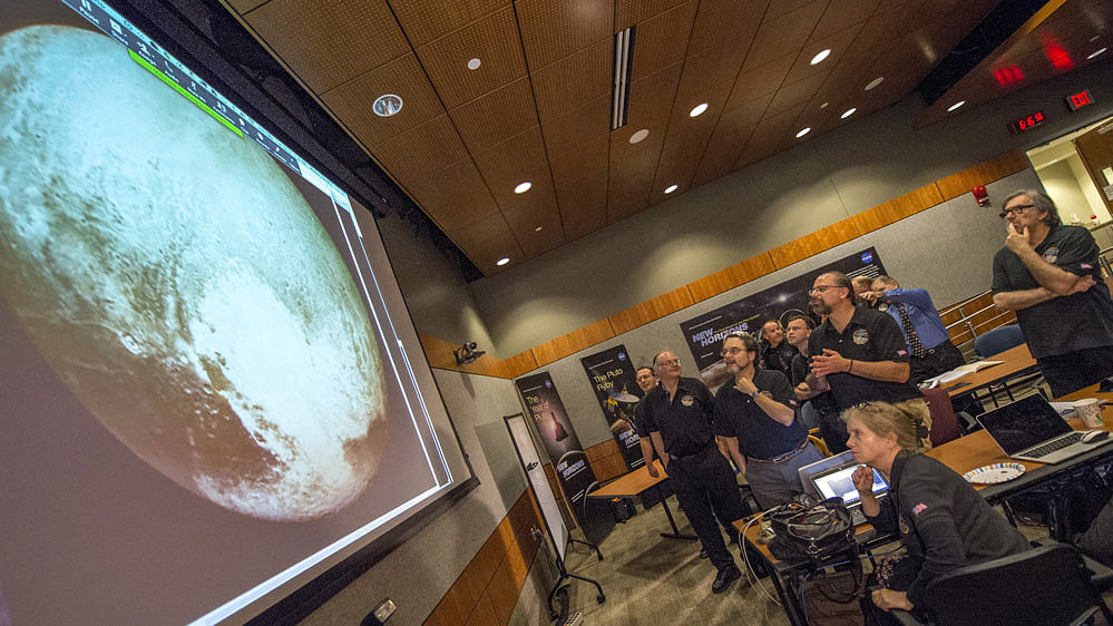 New Horizons science team reacts to seeing the spacecraft’s last and sharpest image of Pluto. (Photo: Reuters)