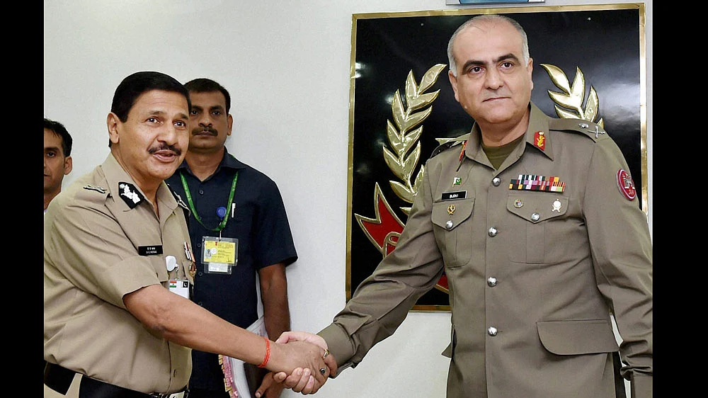 BSF Director General DK Pathak shakes hands with Pakistani Rangers DG, Major General Umar Farooq Burki. (Photo: PTI)