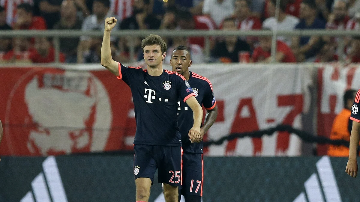 Thomas Mueller celebrates after scoring his side’s opening goal against Olympiakos in their Champions League group match. (Photo: AP)
