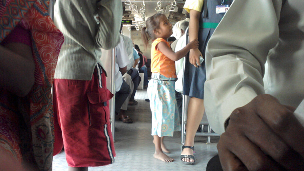 Child begging in a Mumbai local train (Photo courtesy<i>: Lajpatdhingra, Wikimedia Commons, via The News Minute</i>)