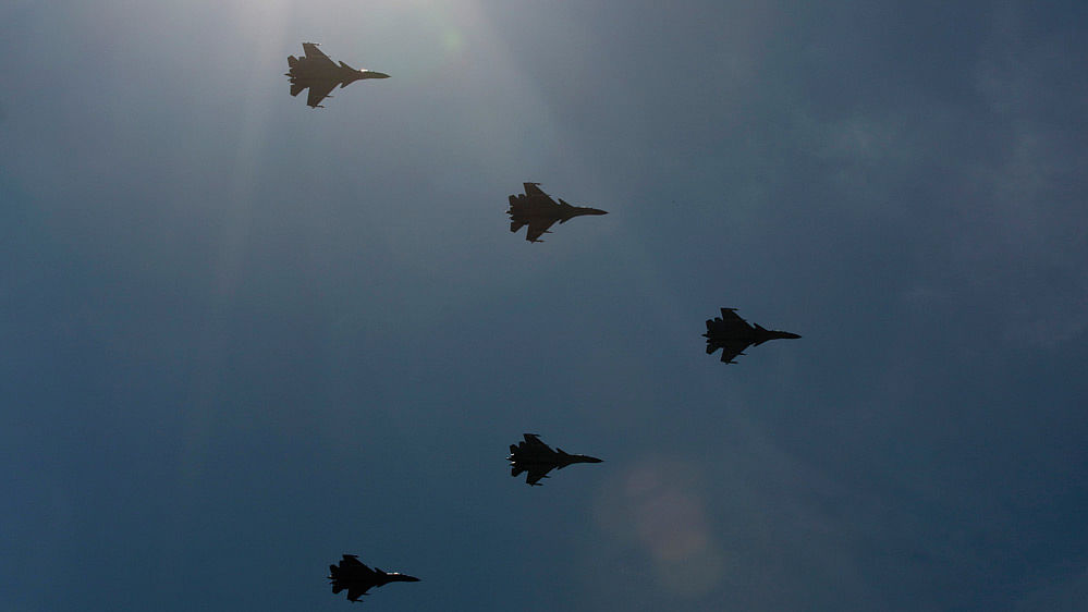 Chinese made carrier-borne J-15 fighter jets fly past Tiananmen Square during a military parade.&nbsp;(Photo: AP)