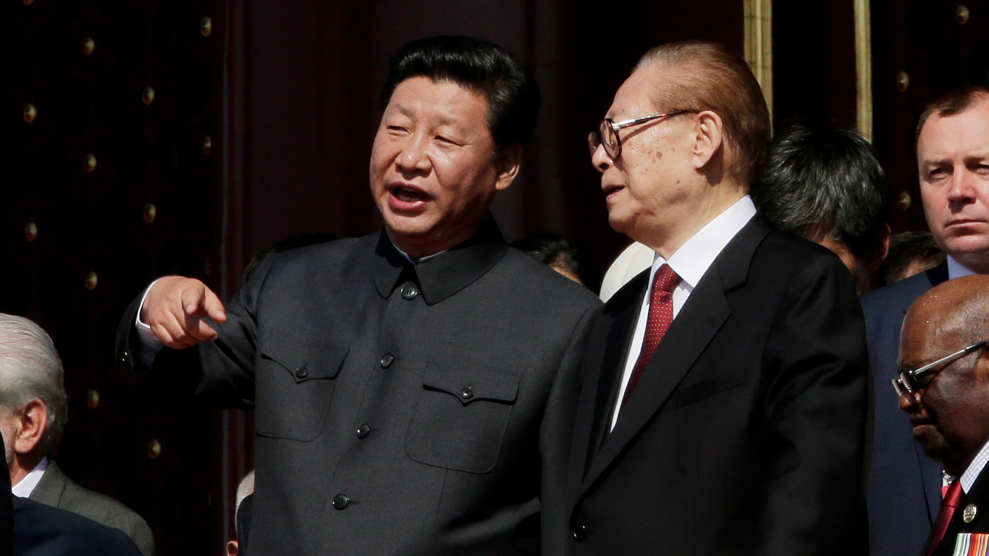 Chinese President Xi Jinping (left) talks with former Chinese President Jian Zemin during a parade commemorating the 70th anniversary of Japan’s surrender in&nbsp;World War II, at Tiananmen Gate, in Beijing. (Photo: AP)