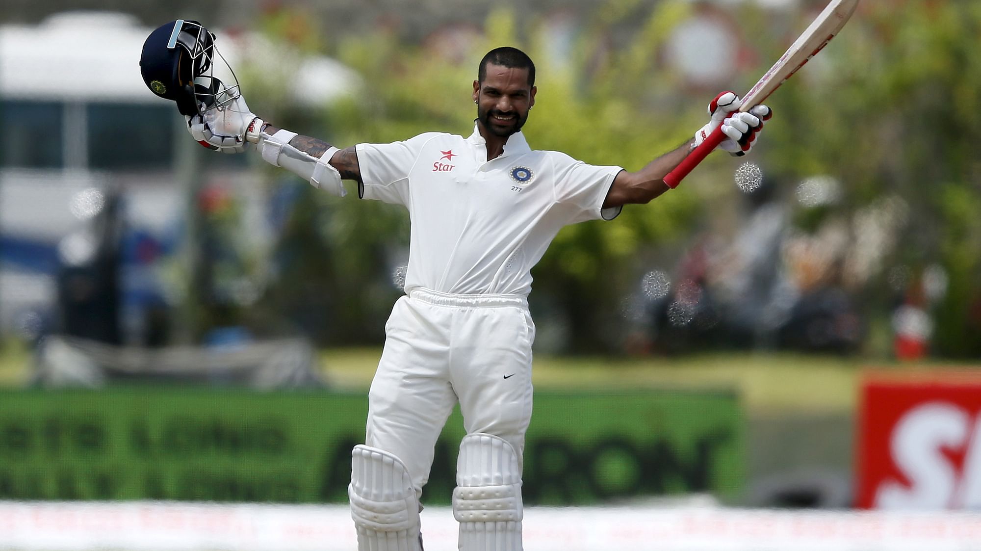 Shikhar Dhawan celebrates his century in the first Test against Sri Lanka at Galle. (Photo: Reuters)