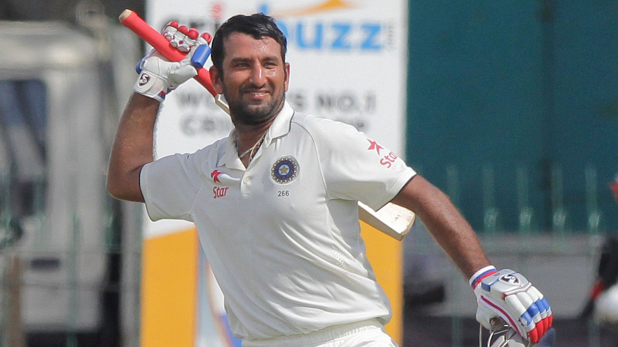 Cheteshwar Pujara celebrates after scoring a hundred against Sri Lanka in the third Test match at Colombo. (Photo: AP)