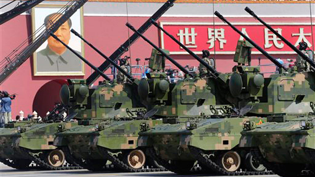 Anti-aircraft artilleries drive past the Tiananmen Gate during a military parade to mark the 70th anniversary of the end of World War II in Beijing, China on Sept. 3, 2015. (Photo: AP)