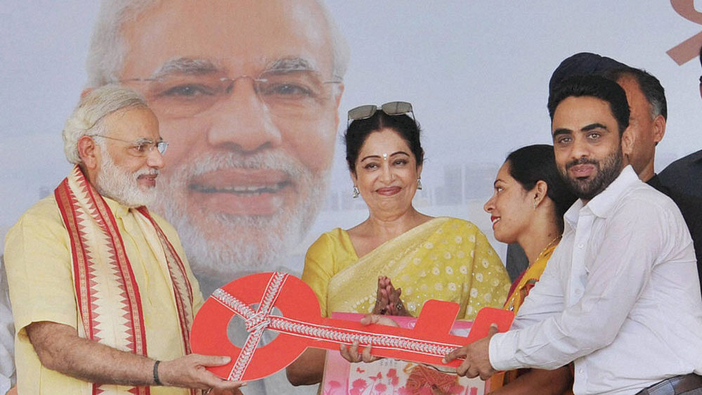 Narendra Modi with BJP MP Kiron Kher during the inauguration of the New Housing Scheme, in Chandigarh. (Photo: PTI)